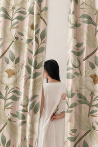 Pair of beige leafy vine botanical curtains in a bedroom