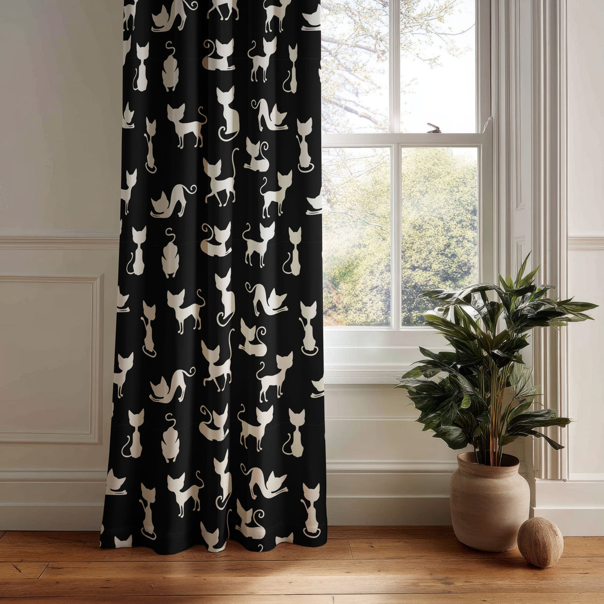 Black cat silhouette kids curtain panel hanging by a white window