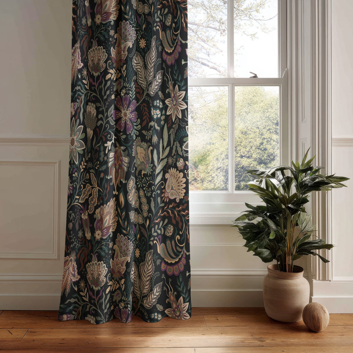 Black moody floral curtain panel hanging by a white window