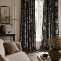 Black moody floral curtains in a living room