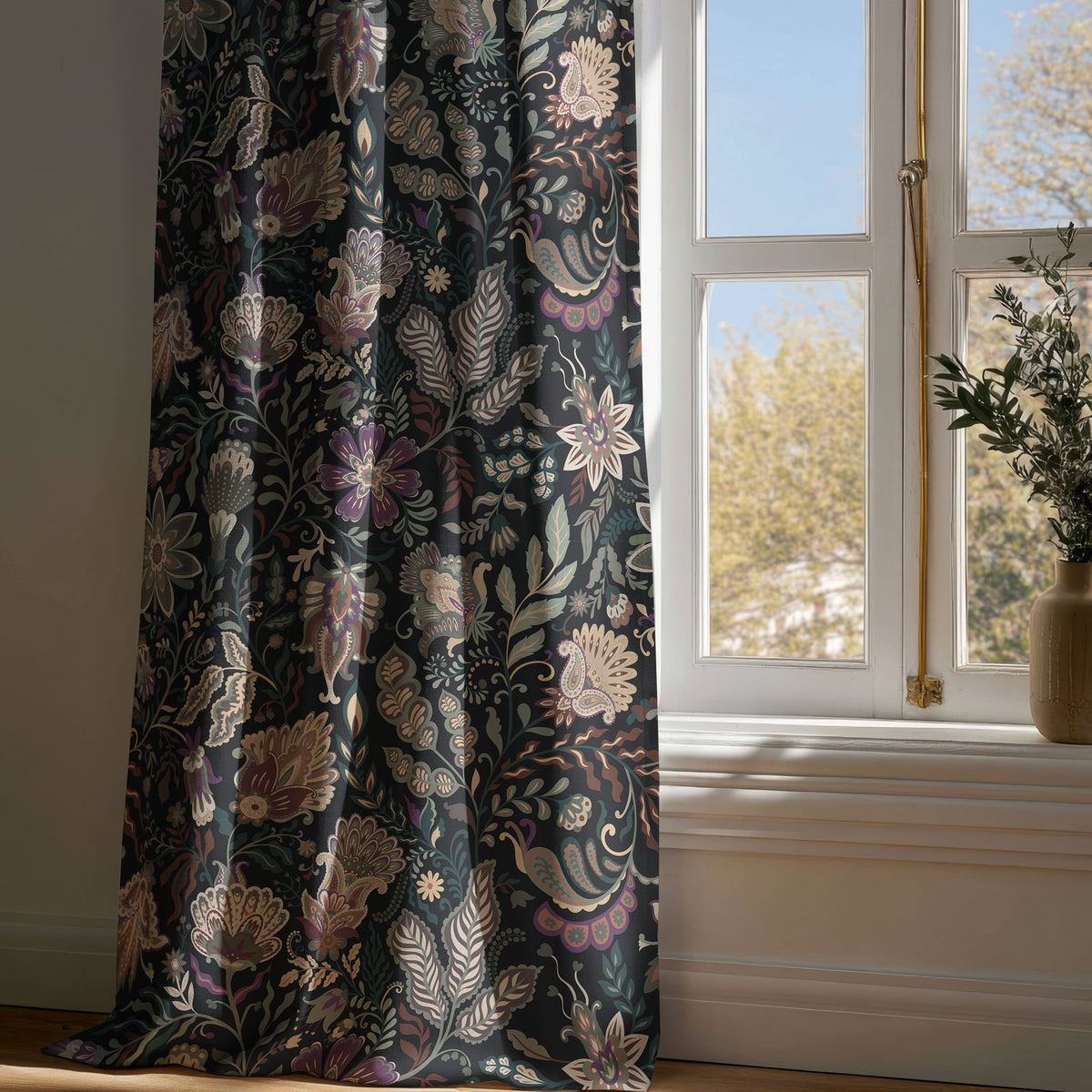 Full-length black moody floral curtain draping to a wooden floor