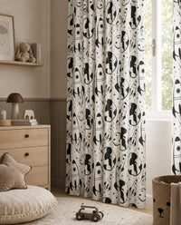 Black and white space rocket kids curtains framing a tall window