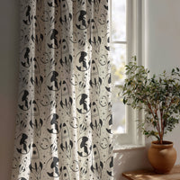 Black and white space rocket kids curtain beside a potted olive tree