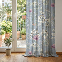 Blue dandelion wildflower curtain at glass patio doors
