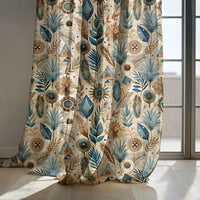Blue folk botanical curtain panels by a sunny window