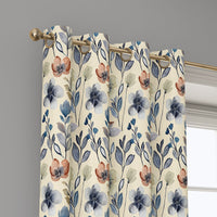 Grommet top of a blue folk wildflower curtain on a brass rod
