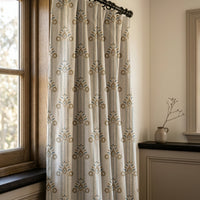 Blue and gold ornamental stripe curtains in a warm living room