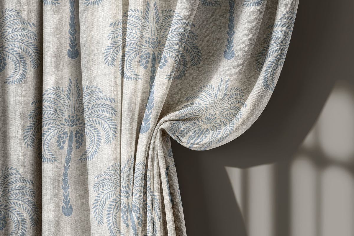 Blue palm tree curtain gathered to one side