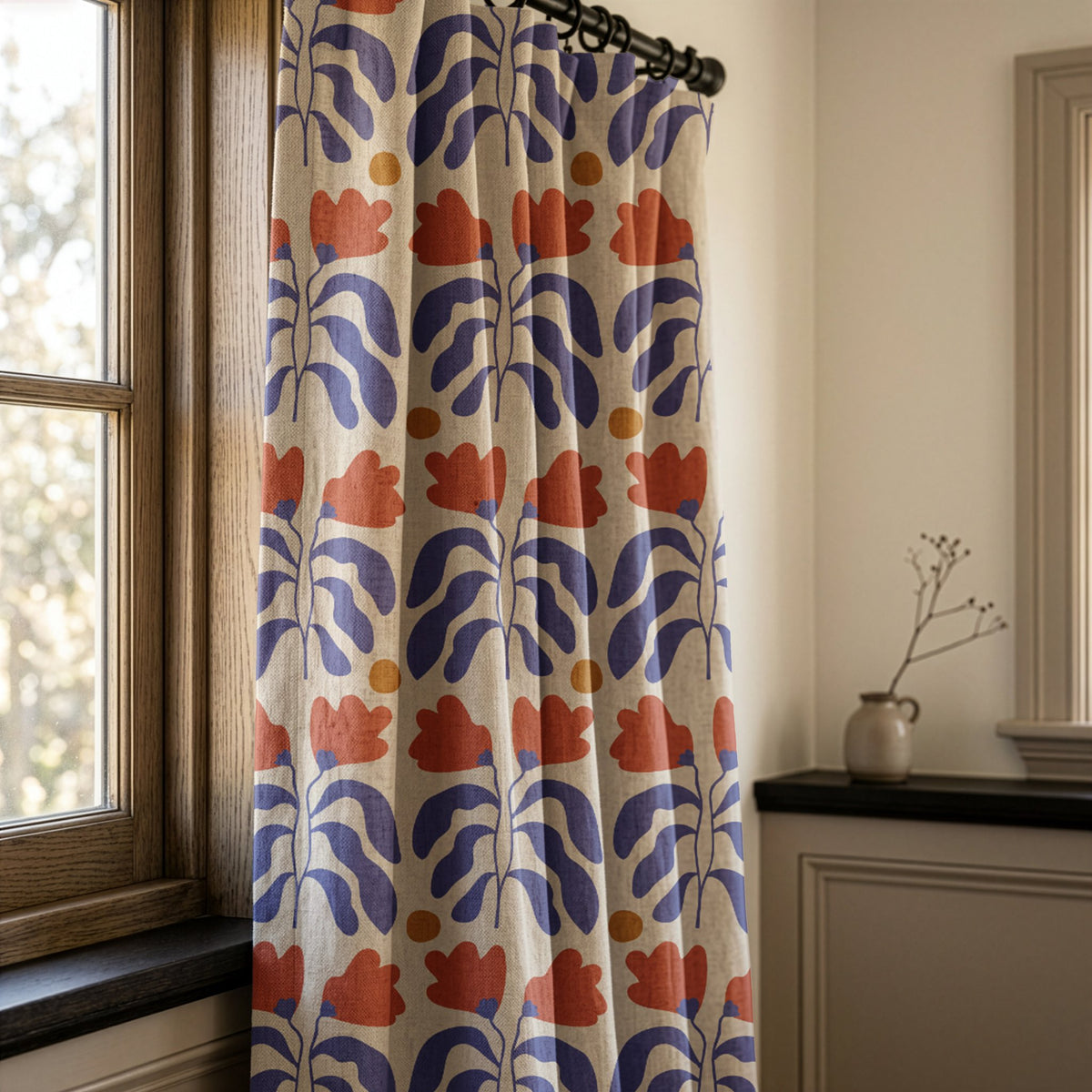 Blue and red cut out leaf curtains in a warm living room