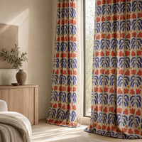 Blue and red cut out leaf curtains in a living room