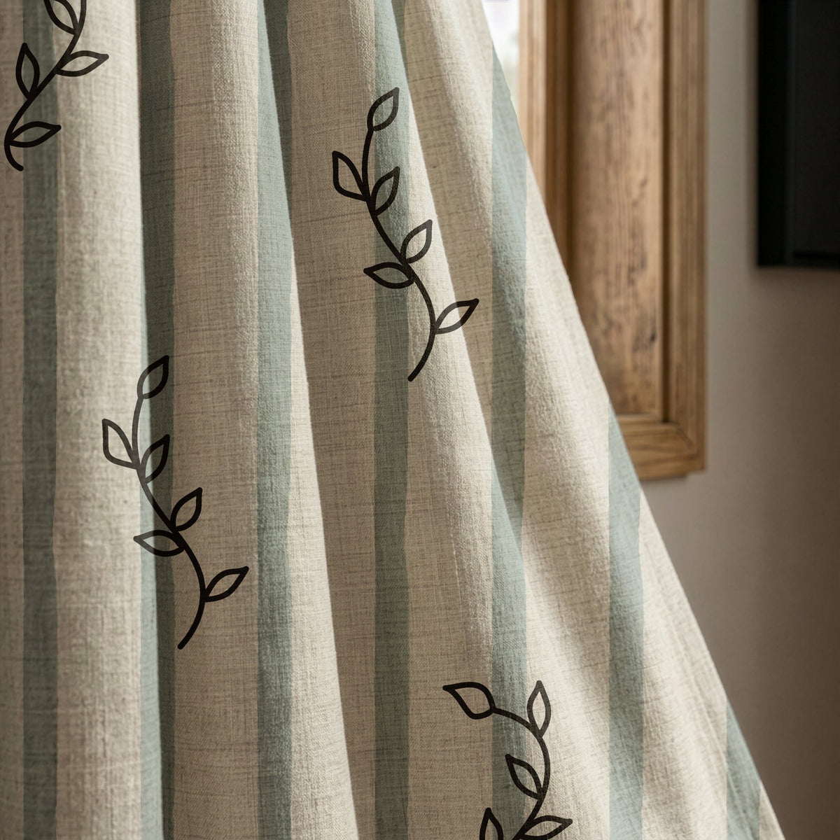 Blue stripe leaf sprig curtain panel beside a rustic wooden window