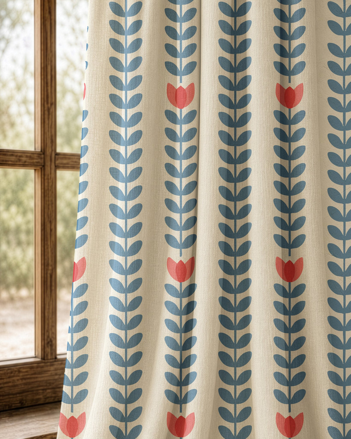 Pair of blue vine and tulip stripe curtains at an arched window
