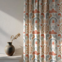 Soft daylight through a boho rainbow nursery curtain