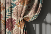 Bold pink and orange floral curtain gathered to one side