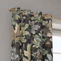 Grommet top of a charcoal oak leaf curtain on a brass rod