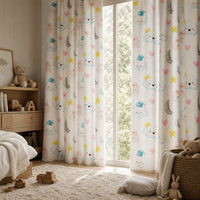 Cloud and moon nursery curtains in a child's bedroom