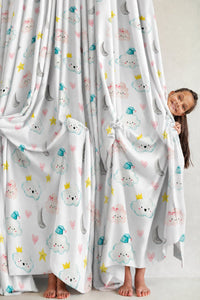 Pair of cloud and moon nursery curtains in a child's bedroom