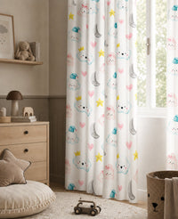 Cloud and moon nursery curtains framing a tall window