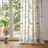 Cloud and moon nursery curtain at glass patio doors