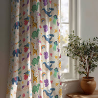Colorful safari animal kids curtain beside a potted olive tree