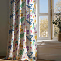 Full-length colorful safari animal kids curtain draping to a wooden floor