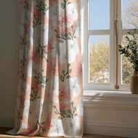 Full-length coral hibiscus floral curtain draping to a wooden floor