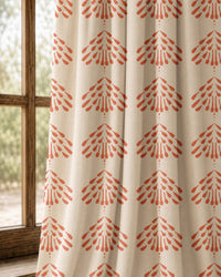 Pair of coral palmette block print curtains at an arched window