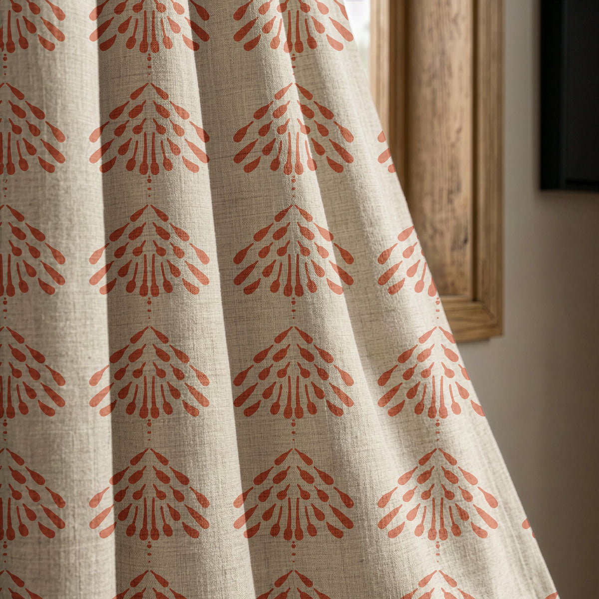 Coral palmette block print curtain panel beside a rustic wooden window