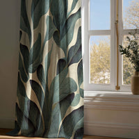 Full-length dark green tropical leaf curtain draping to a wooden floor