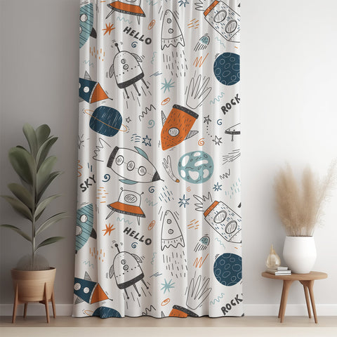 Doodle rocket and ufo kids curtain panel against a white wall