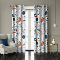 Pair of doodle rocket and ufo kids grommet curtains at French doors
