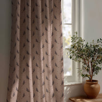 Dusty pink lavender sprig curtain beside a potted olive tree