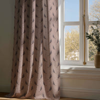 Full-length dusty pink lavender sprig curtain draping to a wooden floor