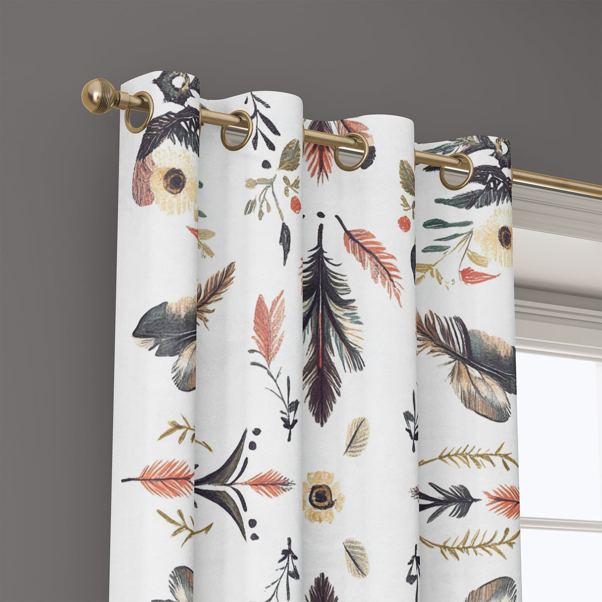 Grommet top of a folk feather print curtain on a brass rod