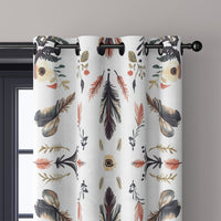 Close-up of folk feather print curtain grommets on a black rod