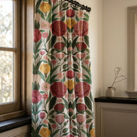 Folk rose and tulip curtains in a warm living room