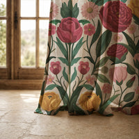 Hem of a folk rose and tulip curtain resting on a stone floor