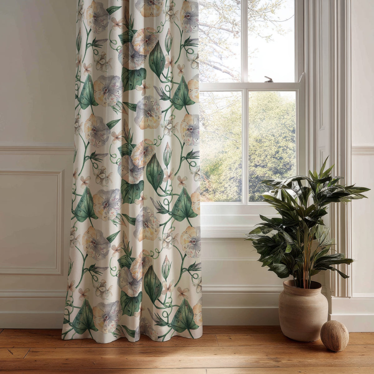 Green ivy botanical curtain panel hanging by a white window