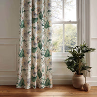 Green ivy botanical curtain panel hanging by a white window