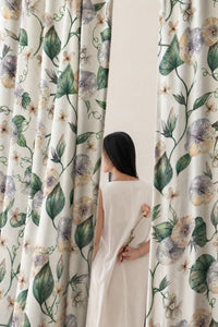 Pair of green ivy botanical curtains in a bedroom