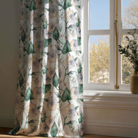 Full-length green ivy botanical curtain draping to a wooden floor