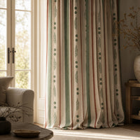 Green and rust painted stripe curtains in a living room