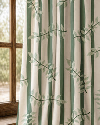 Pair of green stripe leaf vine curtains at an arched window
