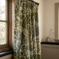 Green thistle botanical curtains in a warm living room