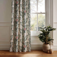Green willow chinoiserie floral curtain panel hanging by a white window
