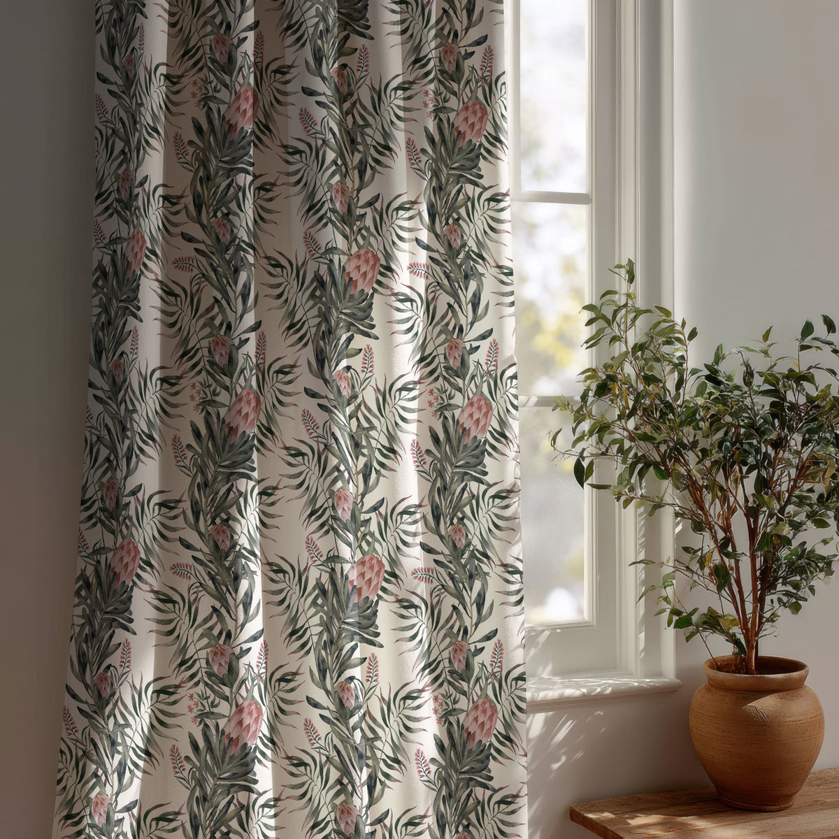 Green willow chinoiserie floral curtain beside a potted olive tree