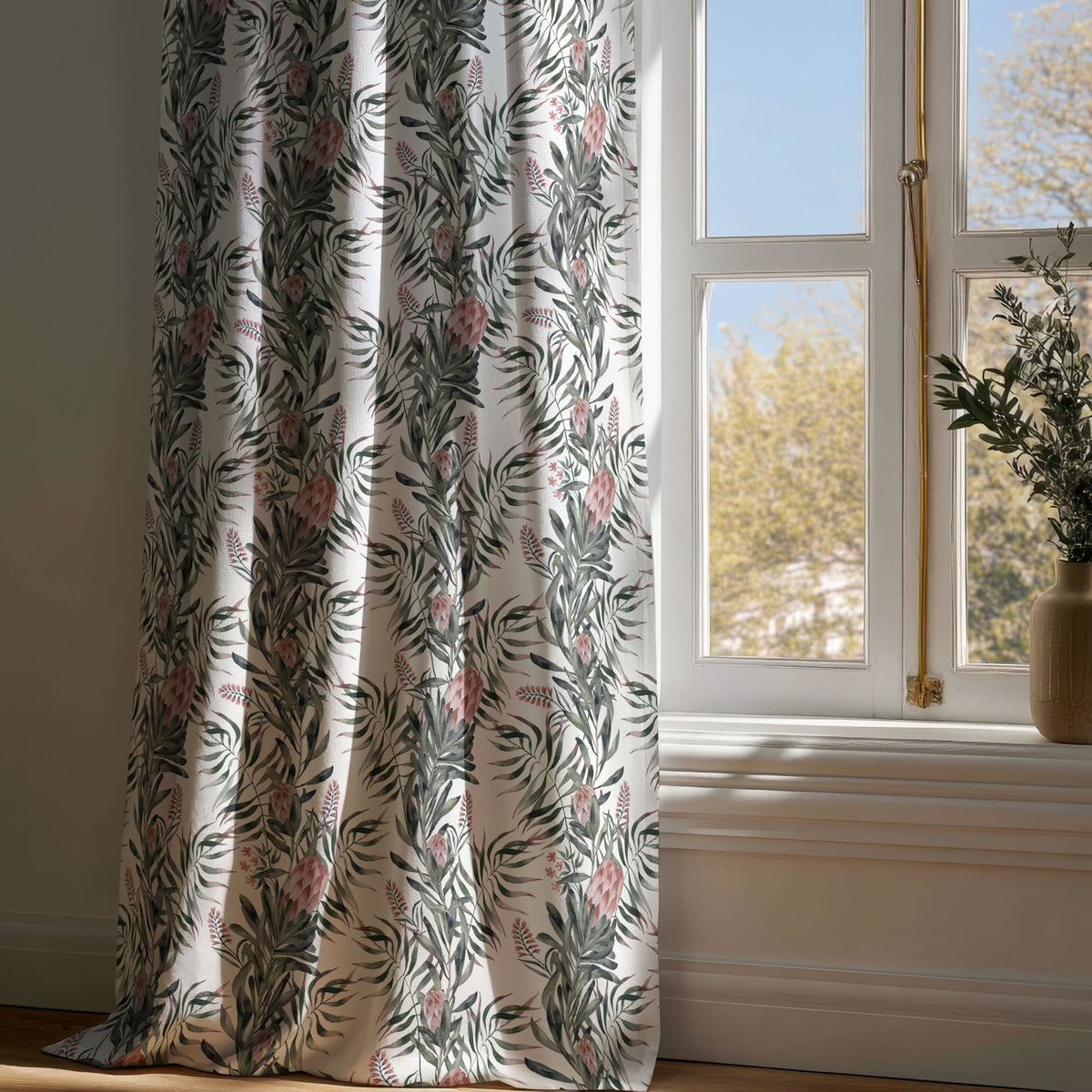 Full-length green willow chinoiserie floral curtain draping to a wooden floor