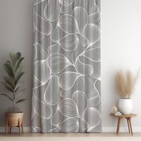 Grey line art leaf curtain panel against a white wall