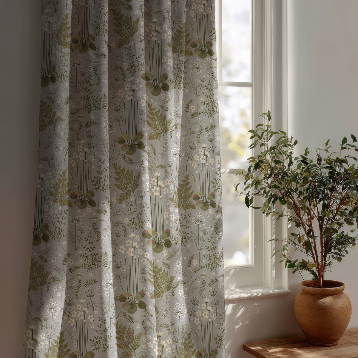 Grey sage botanical floral curtain beside a potted olive tree