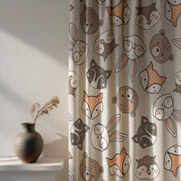 Soft daylight through a grey woodland animal kids curtain